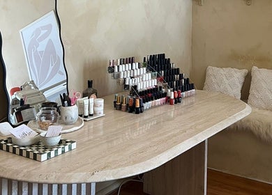 Parlour Box Bondi's chic nail station with a variety of polishes, tools, and cozy seating in New South Wales, AU.
