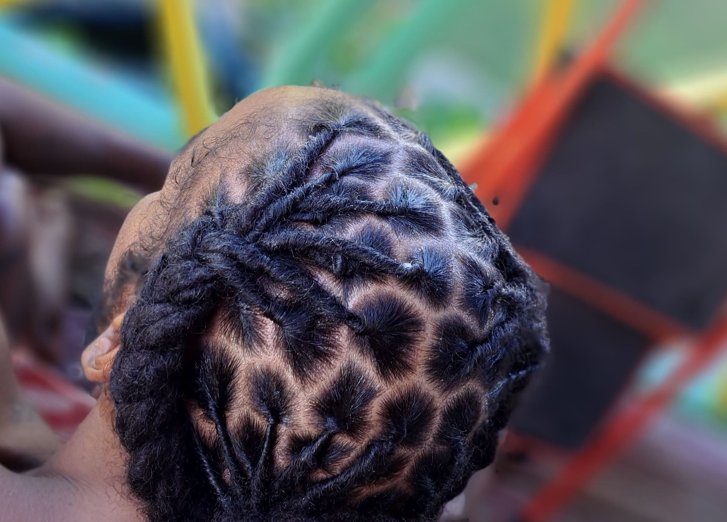 Intricate braided hairstyle at Crowned Beauty By B, Highland, Saint Philip, BB.