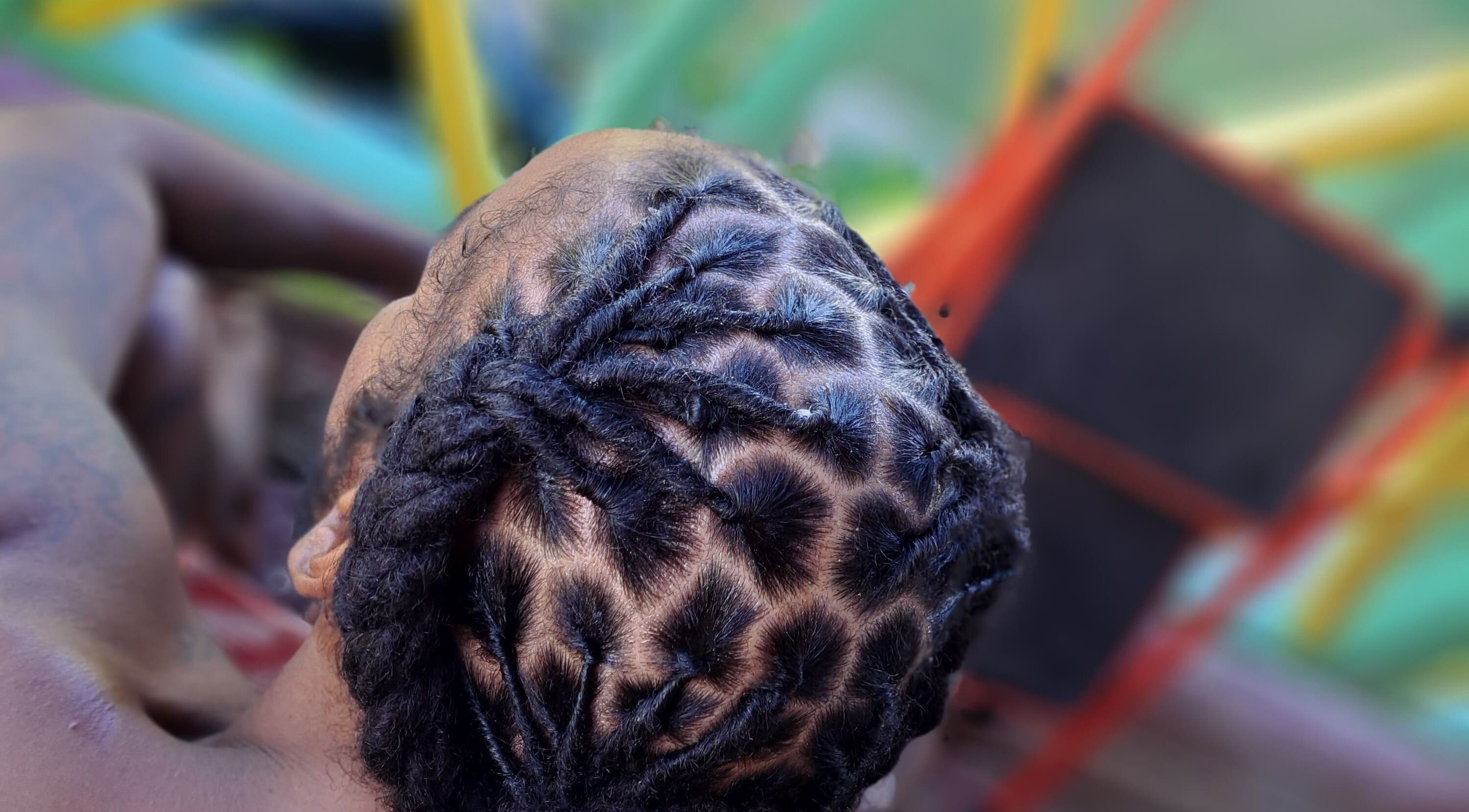 Intricate braided hairstyle at Crowned Beauty By B, Highland, Saint Philip, BB.