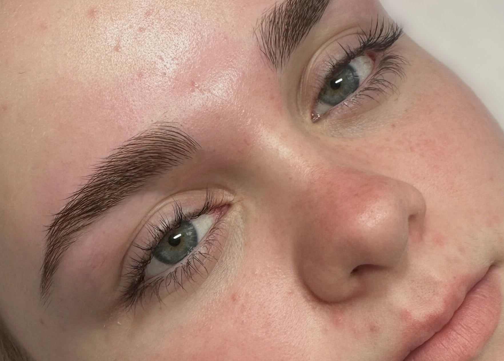 Close-up of perfectly shaped eyebrows at Lash’d by Chan, Gorokan, New South Wales, AU.