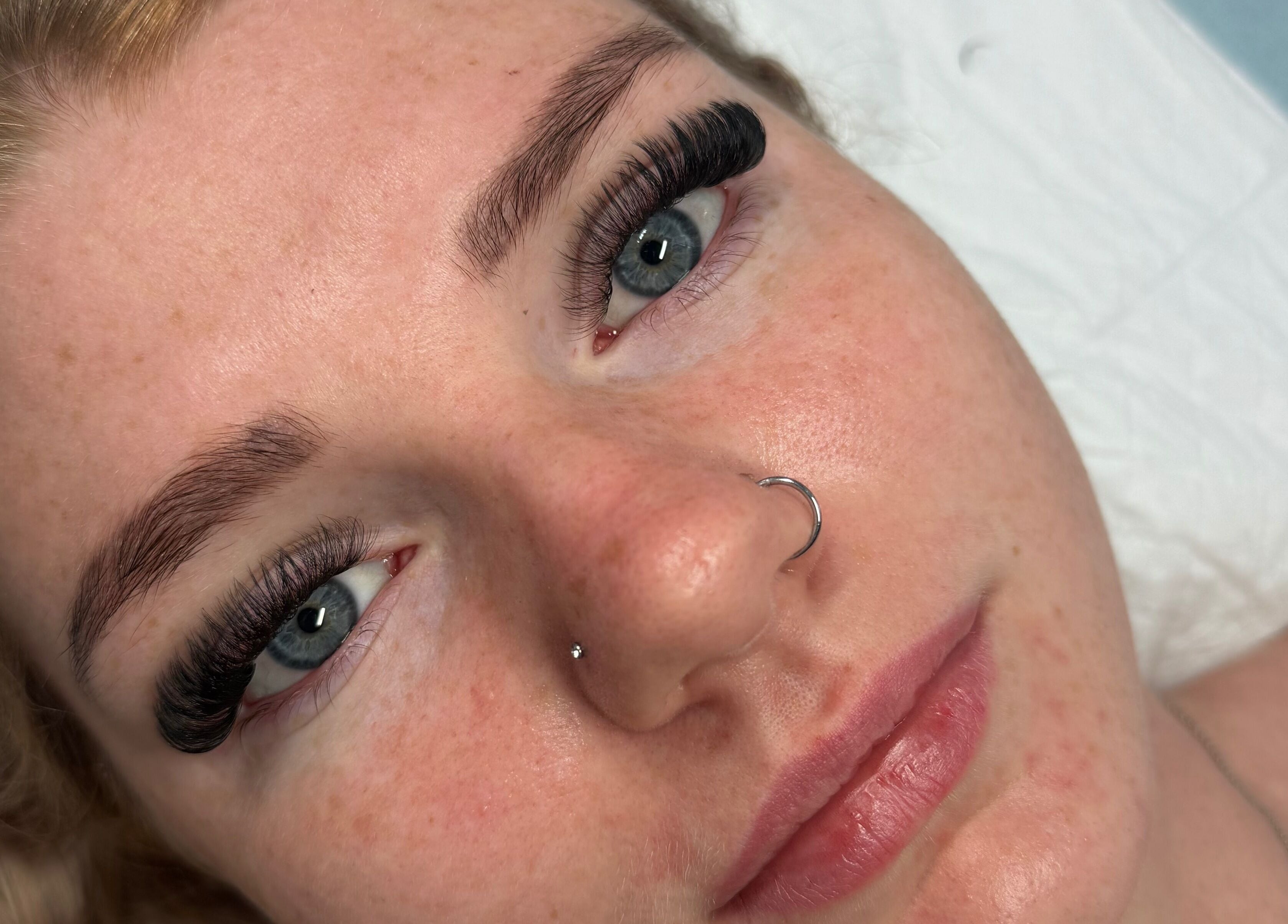 Close-up of woman with elegant eyelash extensions at Lash’d by Chan, Gorokan, New South Wales, AU.