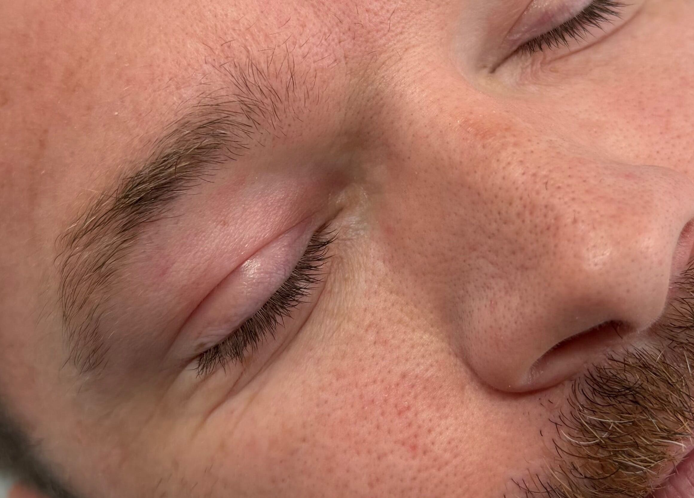 Close-up of a man's face showcasing lash treatment at Lash’d by Chan, Gorokan, New South Wales, AU.