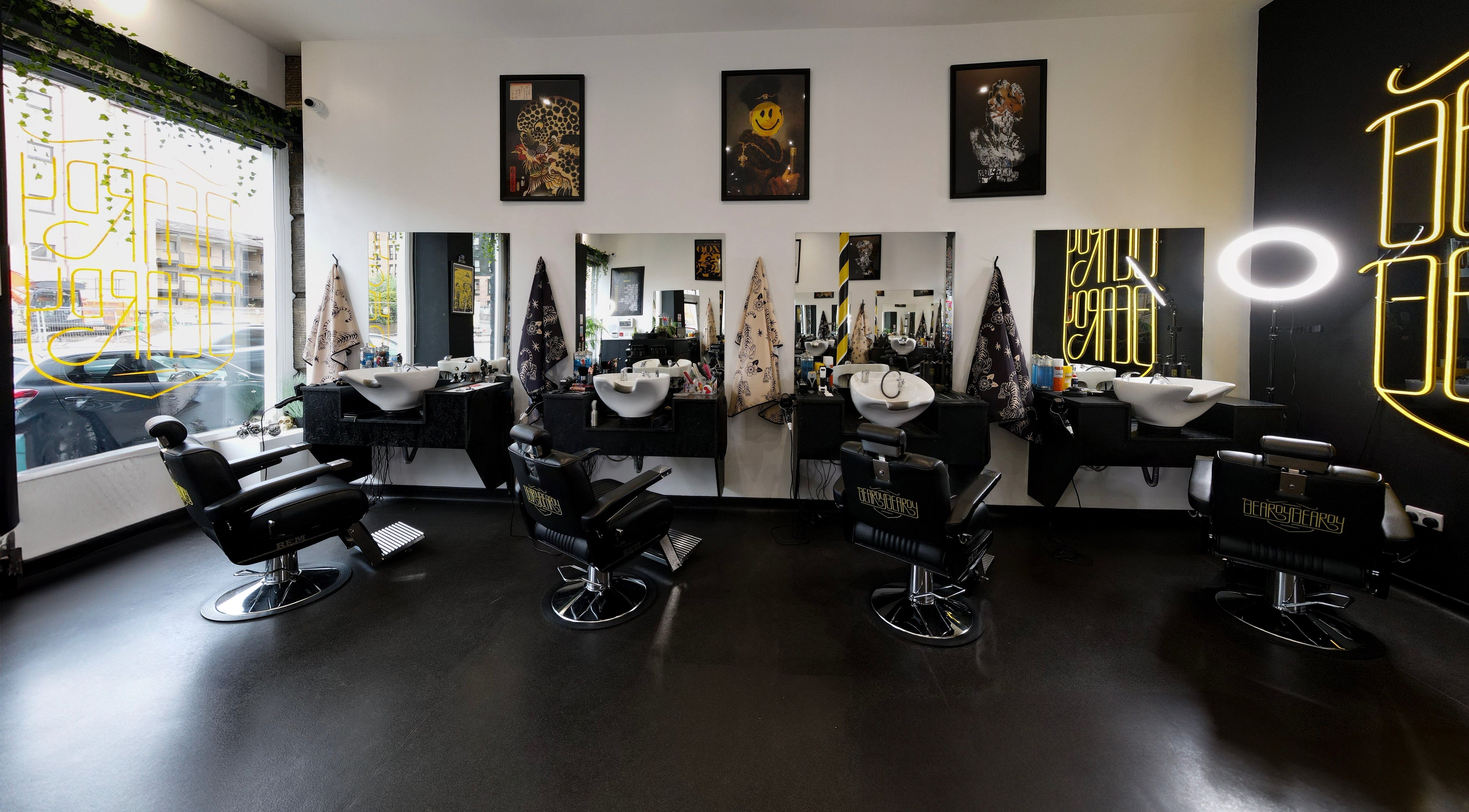 Interior of BeardyBeardyFinnieston with sleek chairs and mirrors in Glasgow, Scotland, GB.