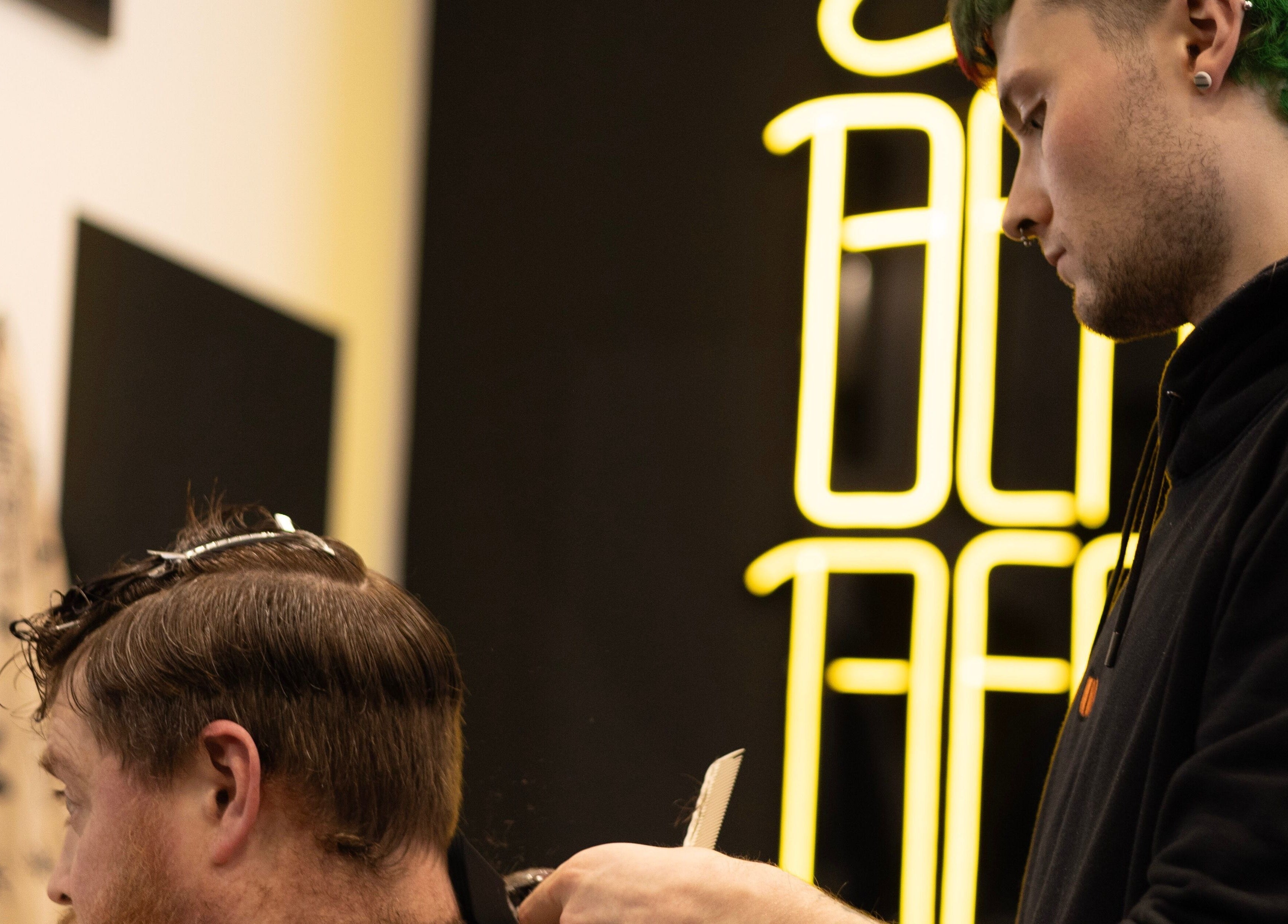 Stylist at BeardyBeardyFinnieston crafting a modern haircut in Glasgow, Scotland, GB.
