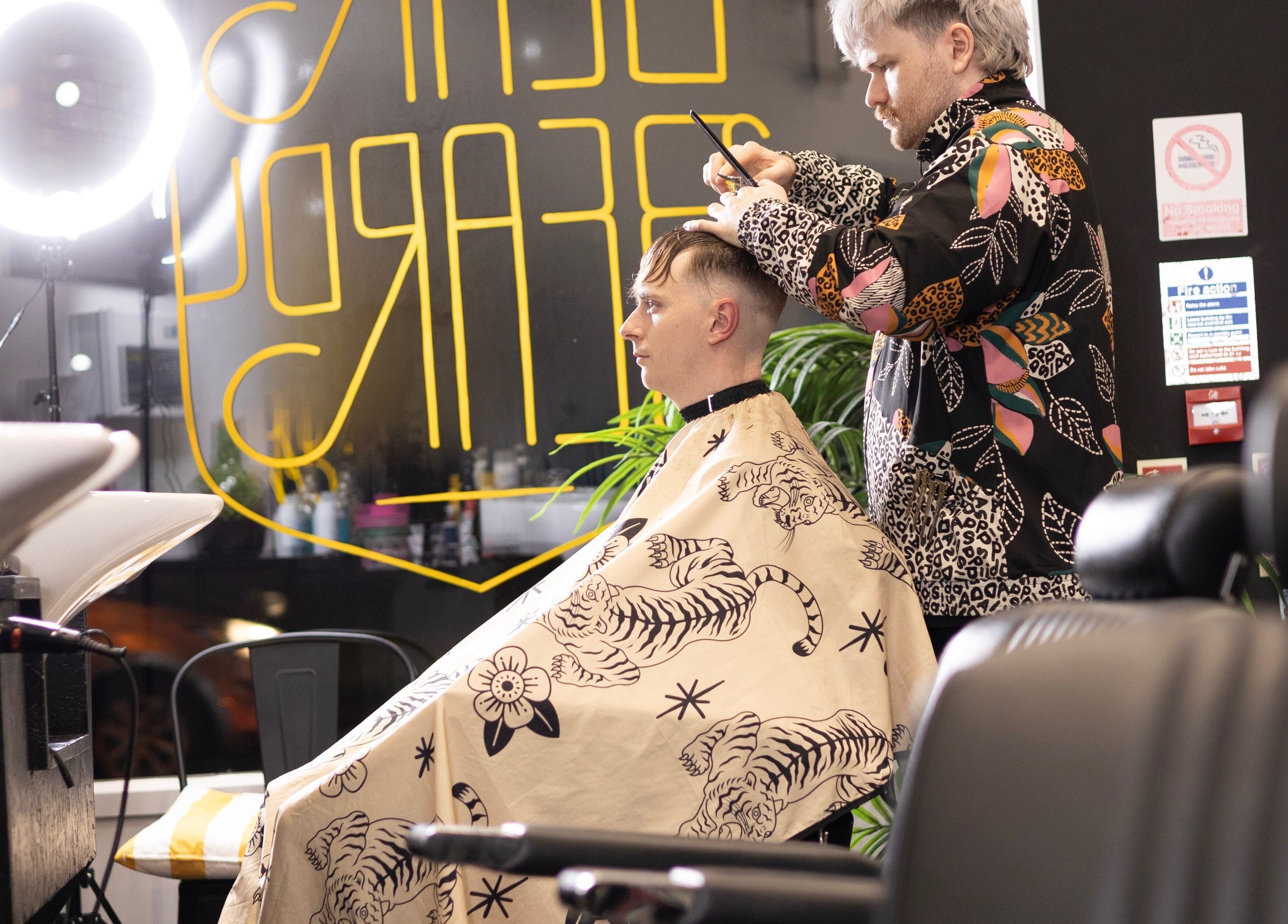 Stylist creating a modern haircut at BeardyBeardyFinnieston, Glasgow, Scotland, GB.