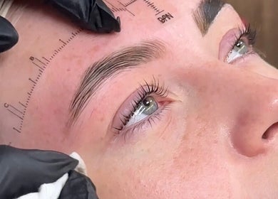 Detail of brow shaping at JL Beauty World, Toronto, Ontario, CA, featuring precise measurement tools.