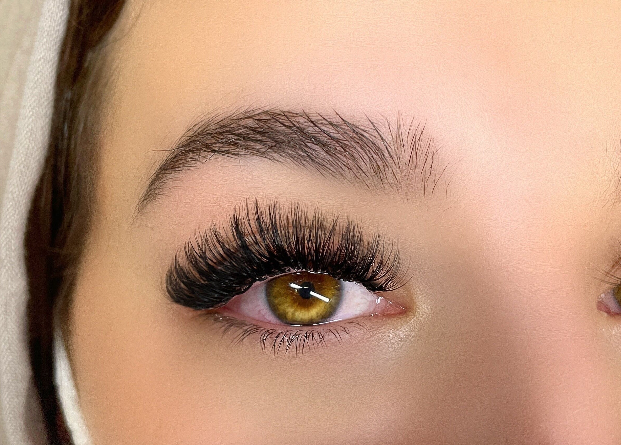 Close-up of enhanced eyelashes at Lashes Studio in San Jose, California, US.
