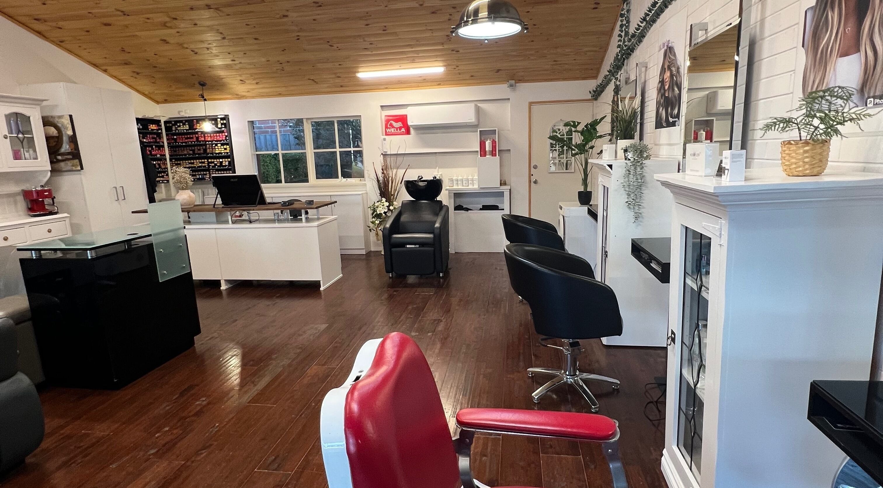 Chic interior of J & J Hair Lux salon, showcasing sleek styling chairs in Melbourne, Victoria, AU.