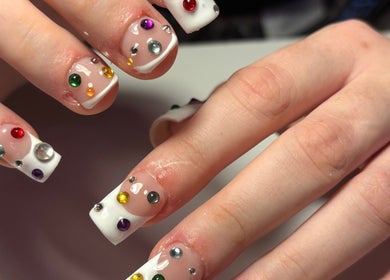 Intricate gemstone nail design at Ctrl Nails, Tinana, Queensland, AU, showcasing elegant white tips.