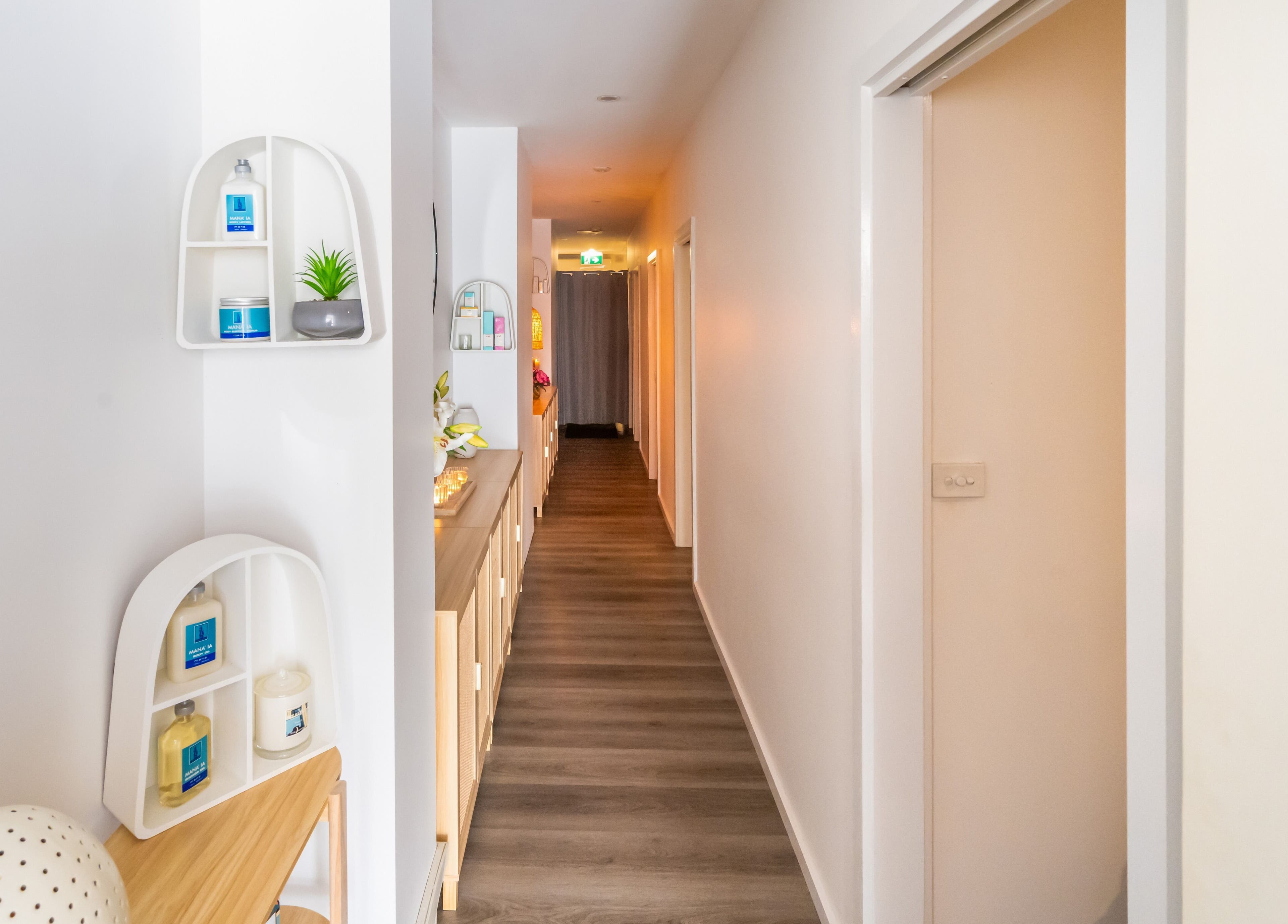 Calm hallway at Timeless Day Spa in Rye, VIC, AU, featuring elegant decor and soothing lighting.