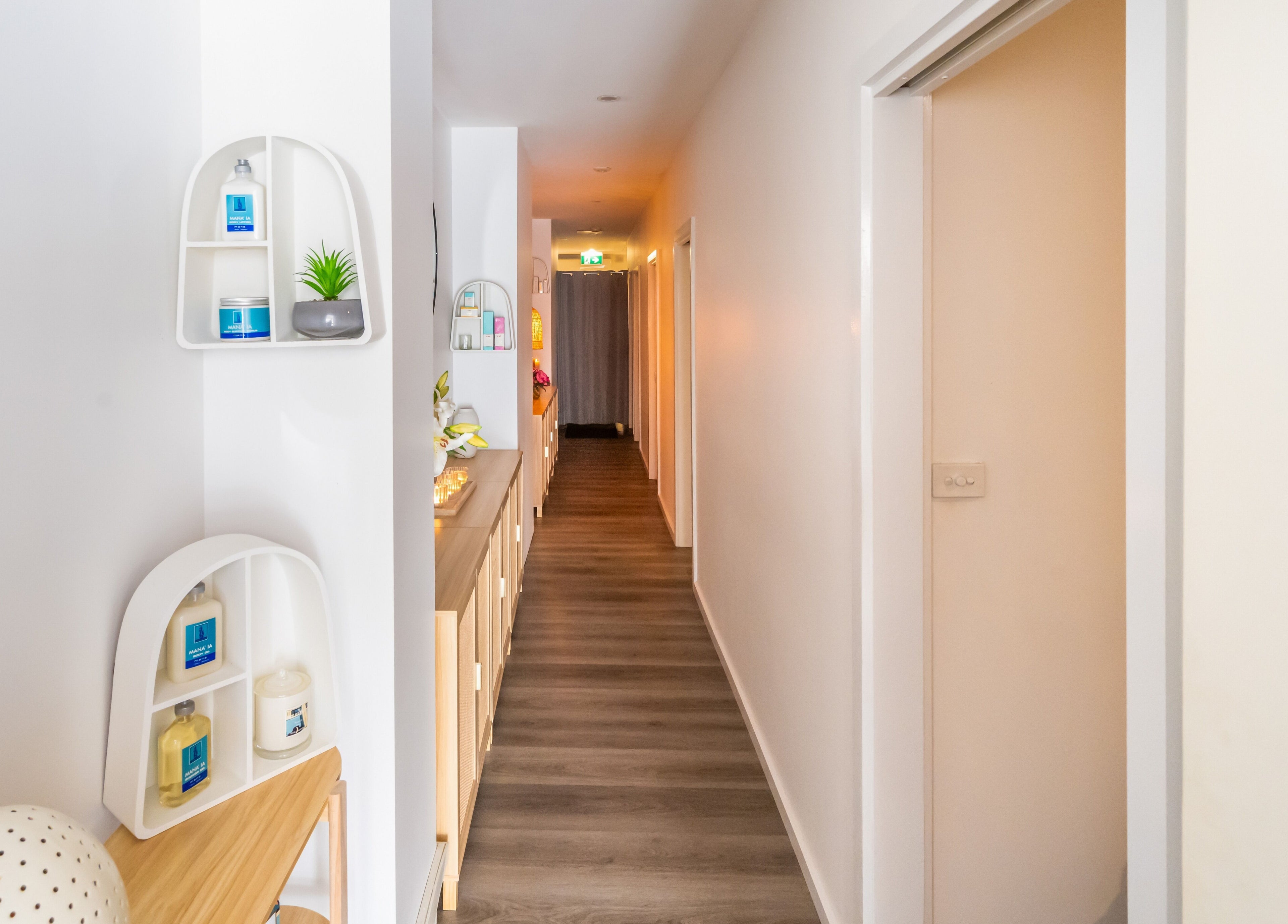 Calm hallway at Timeless Day Spa in Rye, VIC, AU, featuring elegant decor and soothing lighting.