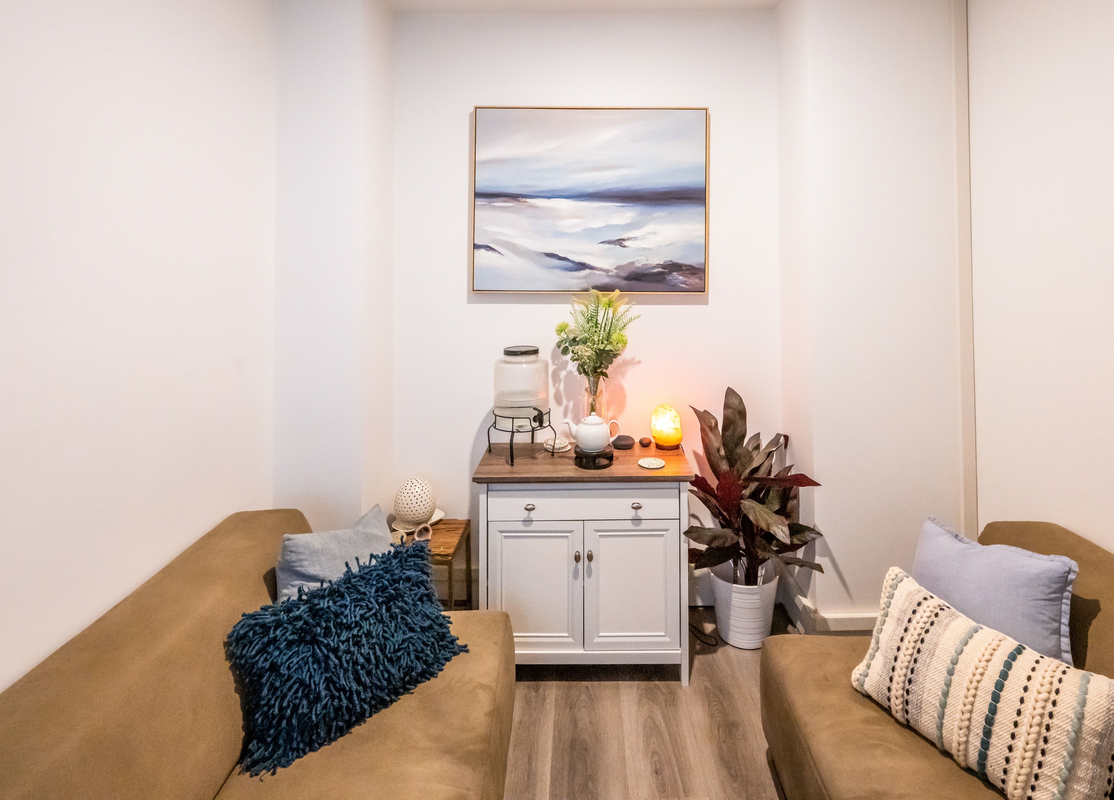 Cozy lounge area at Timeless Day Spa in Rye, VIC, AU, featuring comfortable seating and elegant decor.
