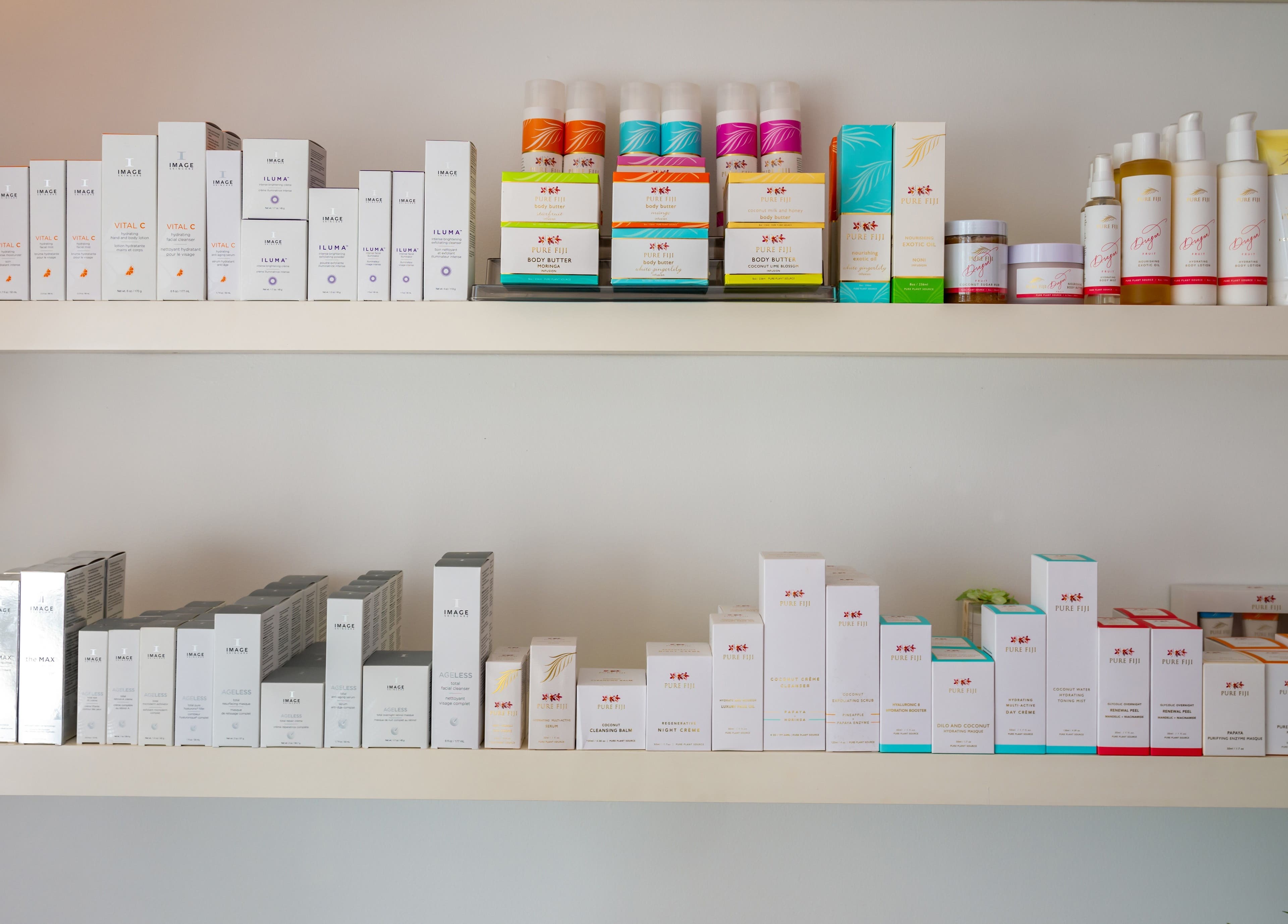 Products displayed on wooden shelves at Timeless Day Spa, Rye, VIC, AU. Enhance your wellness routine.