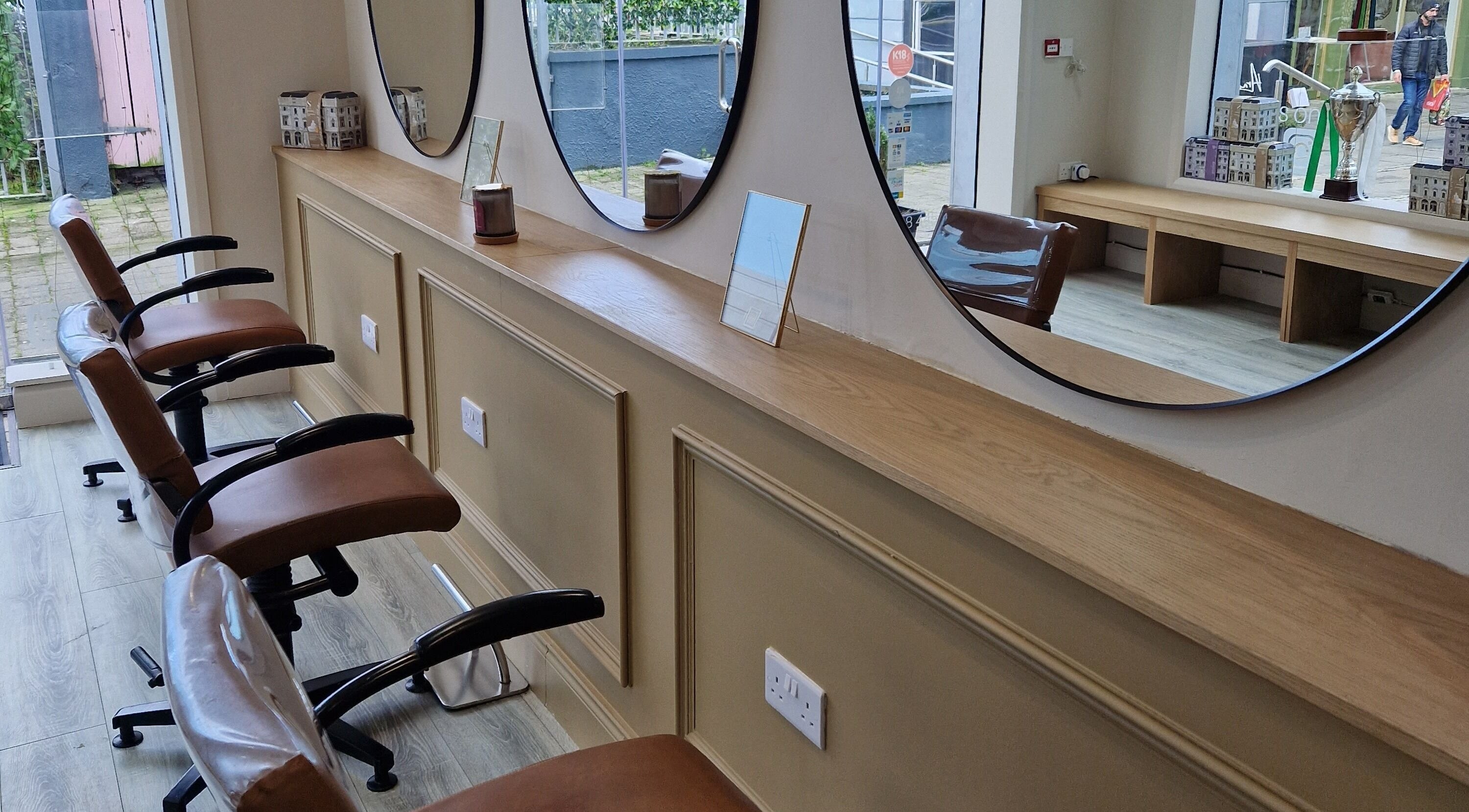 Cozy styling chairs at Linda Smyth Hairdressing, Westport, County Mayo, IE with mirrors and natural light.