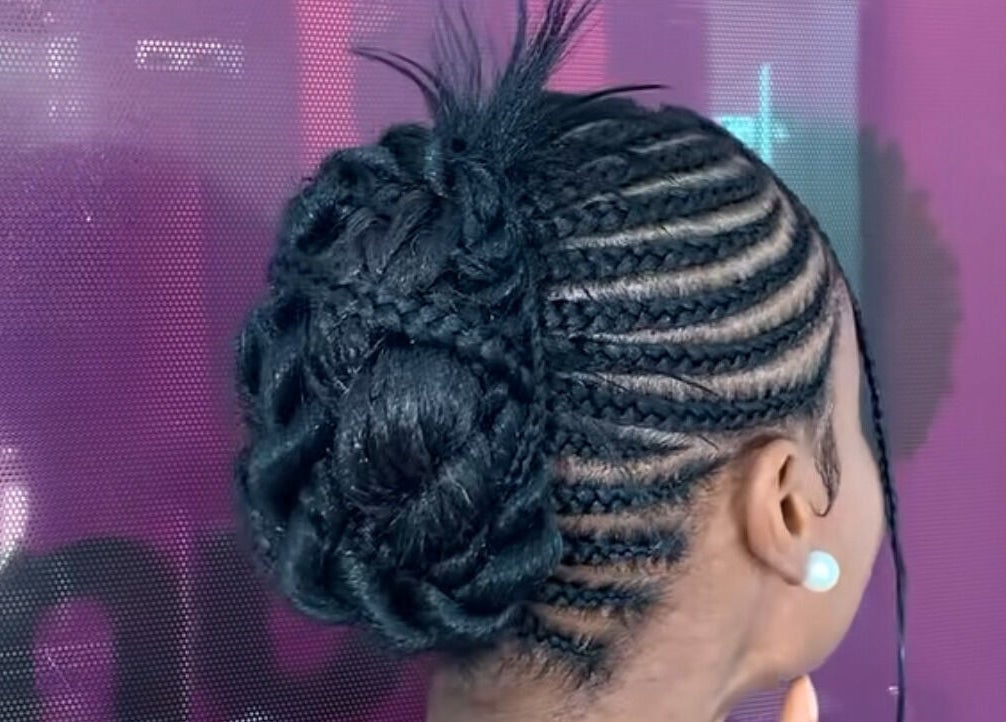 Intricate cornrows styled into a bun at Nuuri Braids n Co, Lagos, NG. Elegant and trendy hair design.