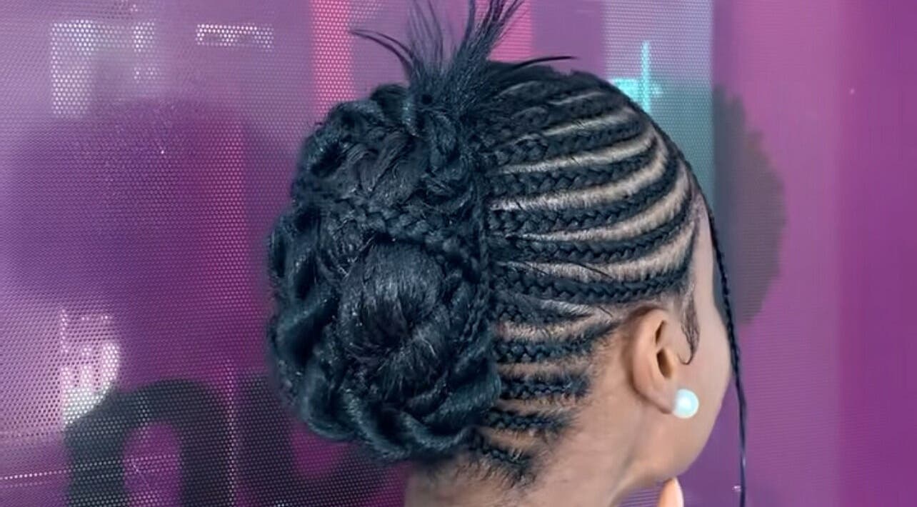 Intricate cornrows styled into a bun at Nuuri Braids n Co, Lagos, NG. Elegant and trendy hair design.