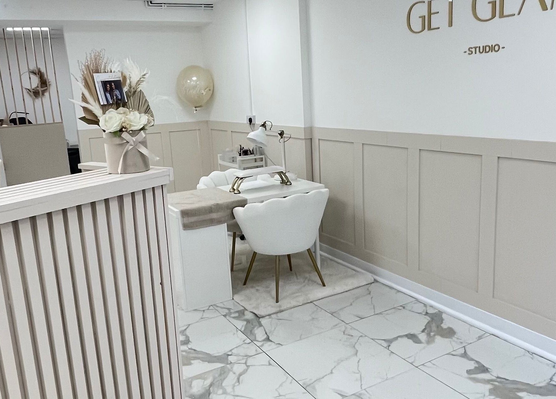 Elegant interior of GET GLAM studio in Blaenavon, Wales, GB, featuring chic manicure station.