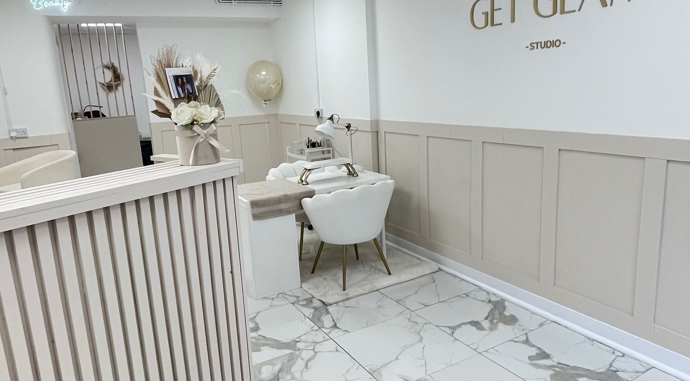 Elegant interior of GET GLAM studio in Blaenavon, Wales, GB, featuring chic manicure station.