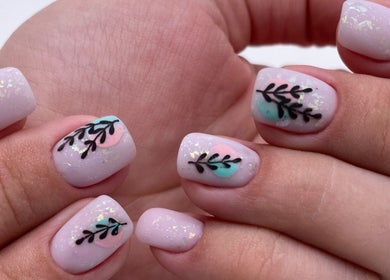 Chic Nail Studio in Arlington, Virginia, US showcases elegant leaf nail art with pastel hues and intricate design.