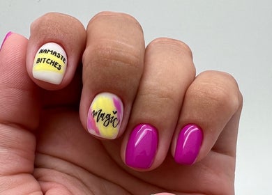 Stylish nail art with 'Namaste Bitches' design at Chic Nail Studio, Arlington, Virginia, US.