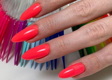 Bright pink nails expertly manicured at Chic Nail Studio, Arlington, Virginia, US, showcasing vibrant elegance.