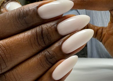 Close-up of elegant white manicure at Chic Nail Studio in Arlington, Virginia, US.