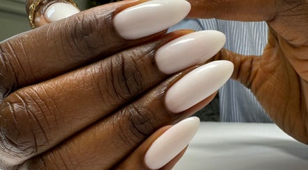 Close-up of elegant white manicure at Chic Nail Studio in Arlington, Virginia, US.