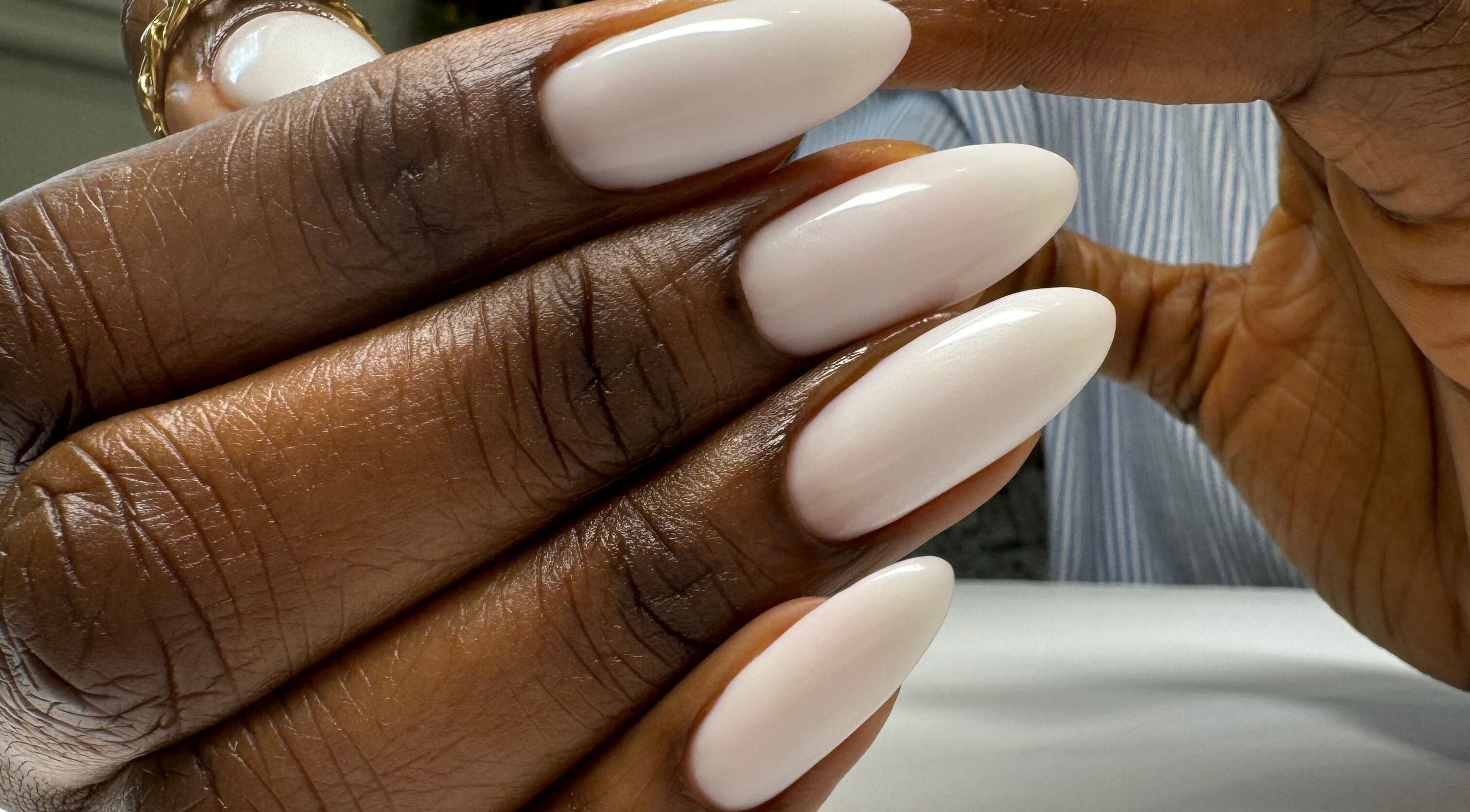 Elegant manicured nails at Chic Nail Studio, Arlington, Virginia, US, showcasing professional nail care.