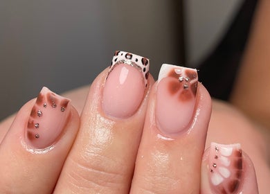 Stylish nail art with intricate designs at Demiejoanna Beauty, Nottingham, England, GB.