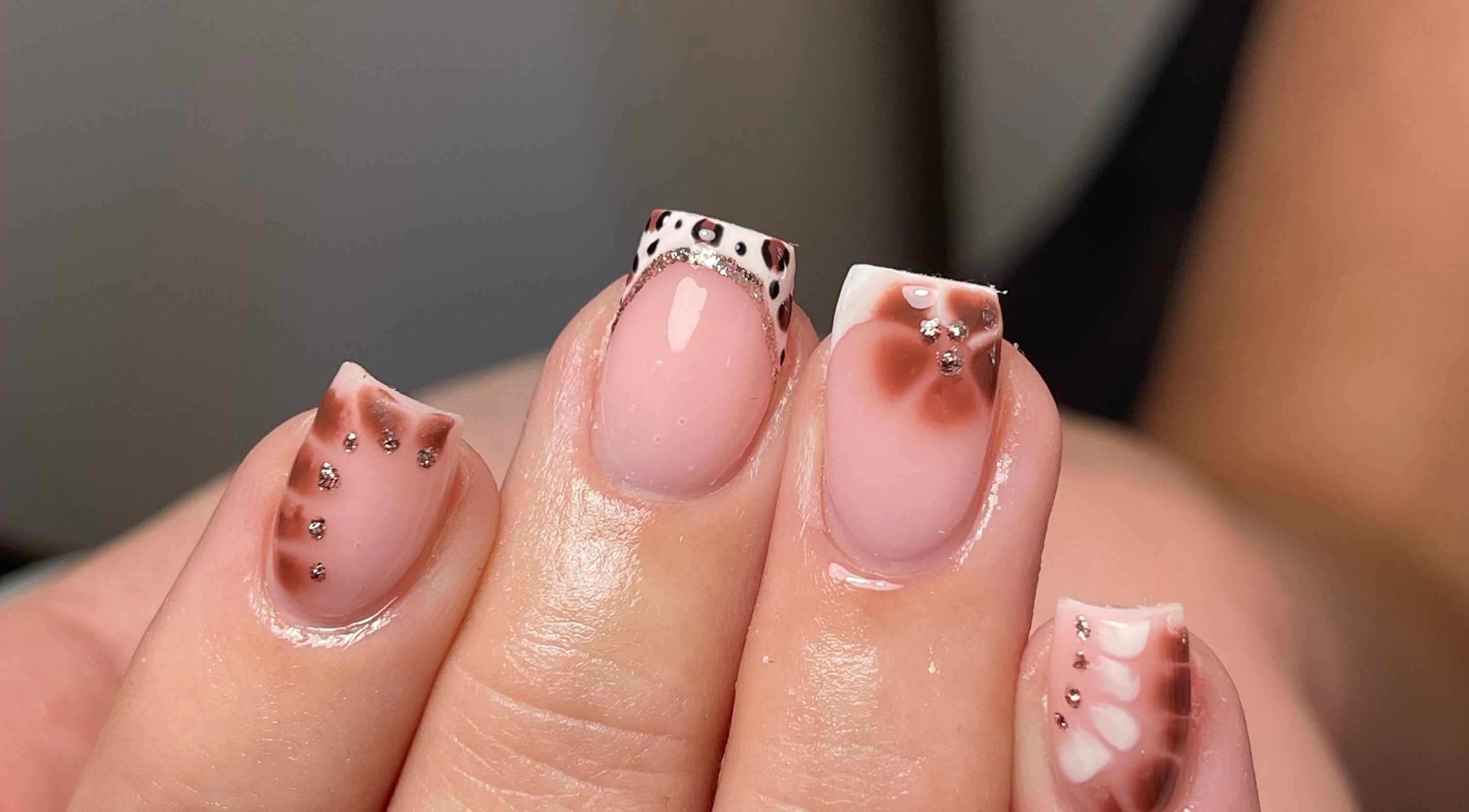Stylish nail art with intricate designs at Demiejoanna Beauty, Nottingham, England, GB.