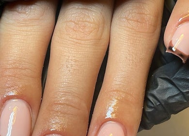Elegant nail art at Demiejoanna Beauty, Nottingham, England, GB showcasing glossy manicure design.