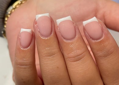 Close-up of elegant French manicure at Demiejoanna Beauty, Nottingham, England, GB.