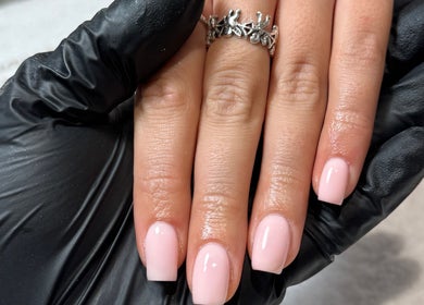 Manicured nails with pink polish at Demiejoanna Beauty, Nottingham, England, GB.