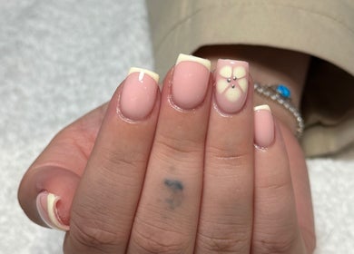 Elegant nail design with floral accents at Demiejoanna Beauty, Nottingham, England, GB.
