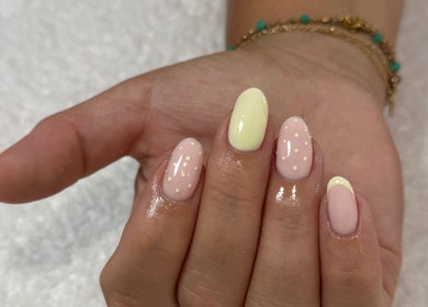 Gorgeous pastel nail art by Demiejoanna Beauty in Nottingham, England, GB. Features soft pink and yellow dots.