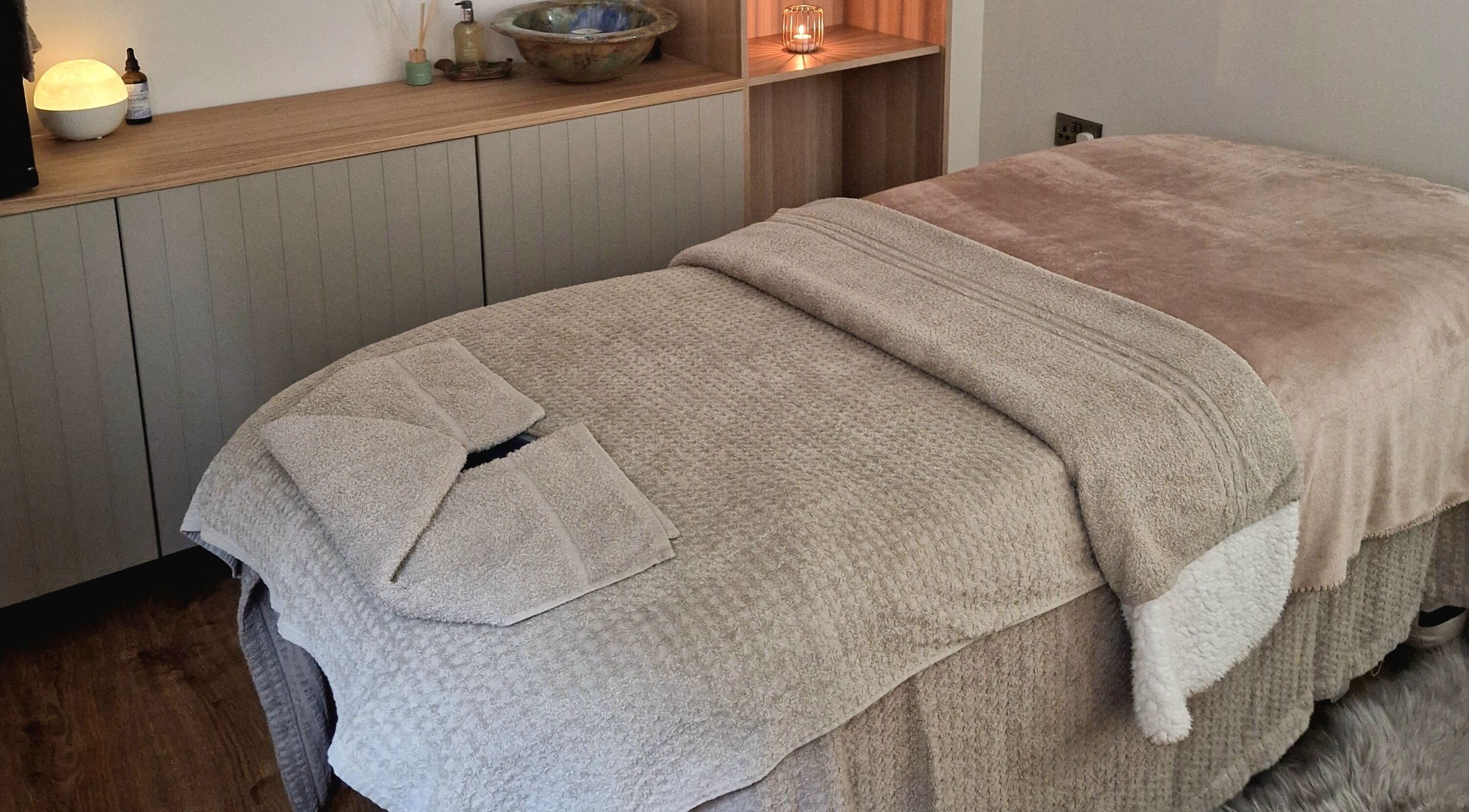Tranquil massage room at Grange House Therapies, Burntisland, Scotland, GB, featuring a cozy treatment bed.