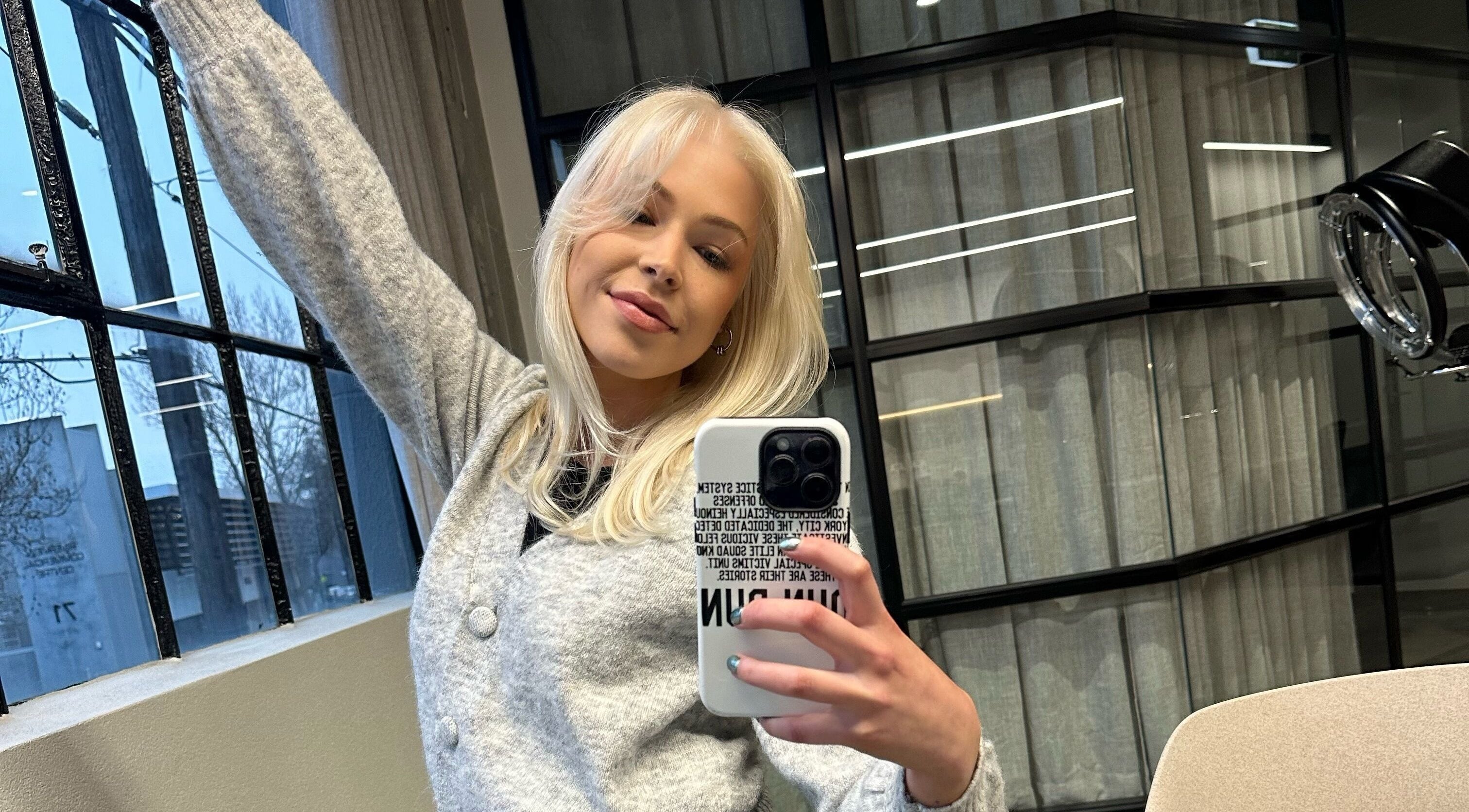 Client enjoying a sunny moment at Izzy Hanson salon, Melbourne, Victoria, AU.