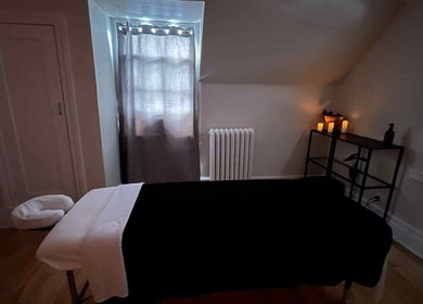 Tranquil massage room at Massotherapie - Sophia F. in Sainte-anne-de-bellevue, Québec, CA with soft lighting.