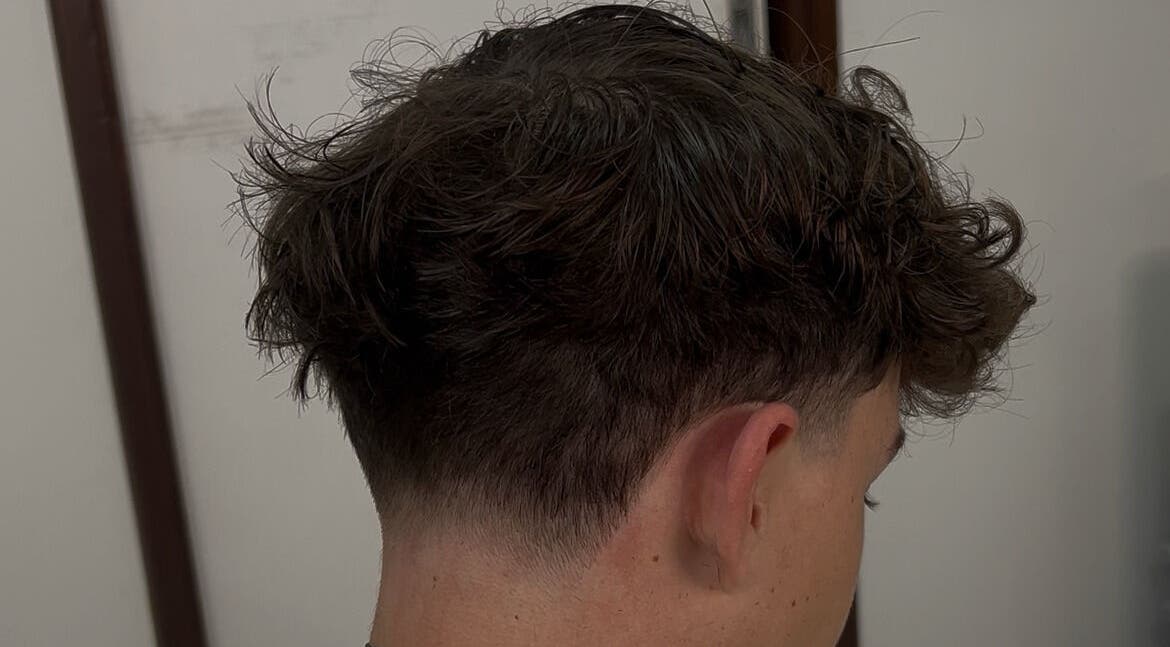 Stylish haircut at zacW in Killarney Heights, New South Wales, AU, showcasing expertly faded sides.