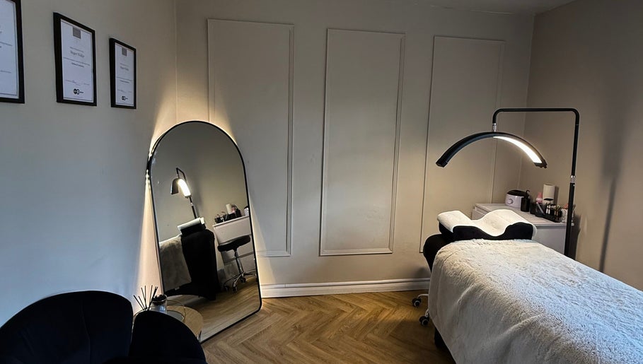 Elegant treatment room at Luxe Beauty, Ripon, England, GB, featuring a plush massage table and ambient lighting.