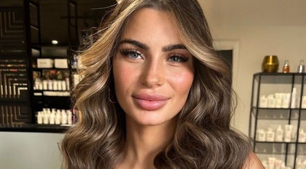 Elegant woman with styled hair at Glowbykarla Beauty, Bradfield, New South Wales, AU.