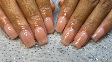 Elegant manicured nails at Touch of Amie in Taylor, Michigan, US, showcasing glossy, natural finish.
