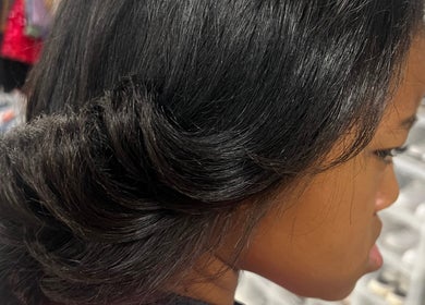 Sleek side view hairstyle at Touch of Amie in Taylor, Michigan, US, emphasizing expert hair styling.