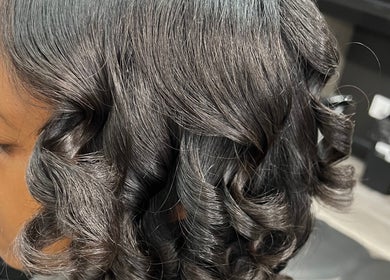 Elegant curly hairstyle at Touch of Amie, Taylor, Michigan, US.