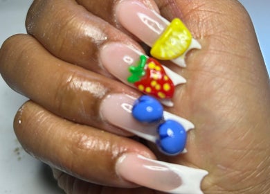 Vibrant fruit nail art at Touch of Amie in Taylor, Michigan, US. Features detailed strawberry and blueberry designs.