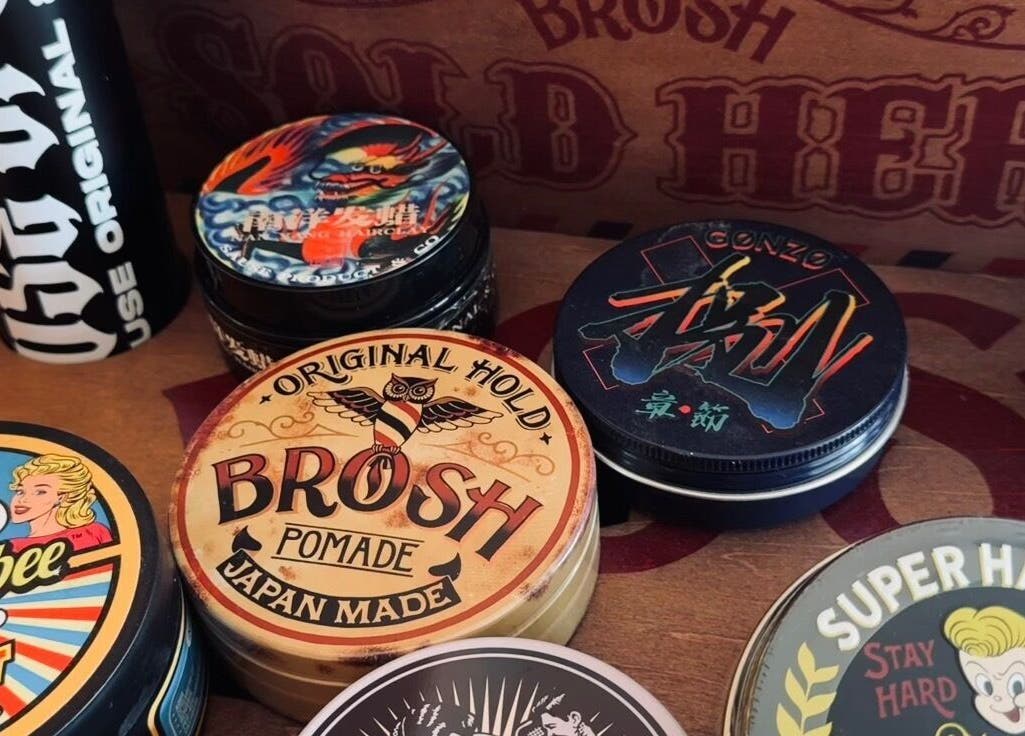 Diverse pomade tins at Sause Barber Cut Club - Sungai Ara, Bayan Lepas, Pulau Pinang, MY showcasing hair styling products.
