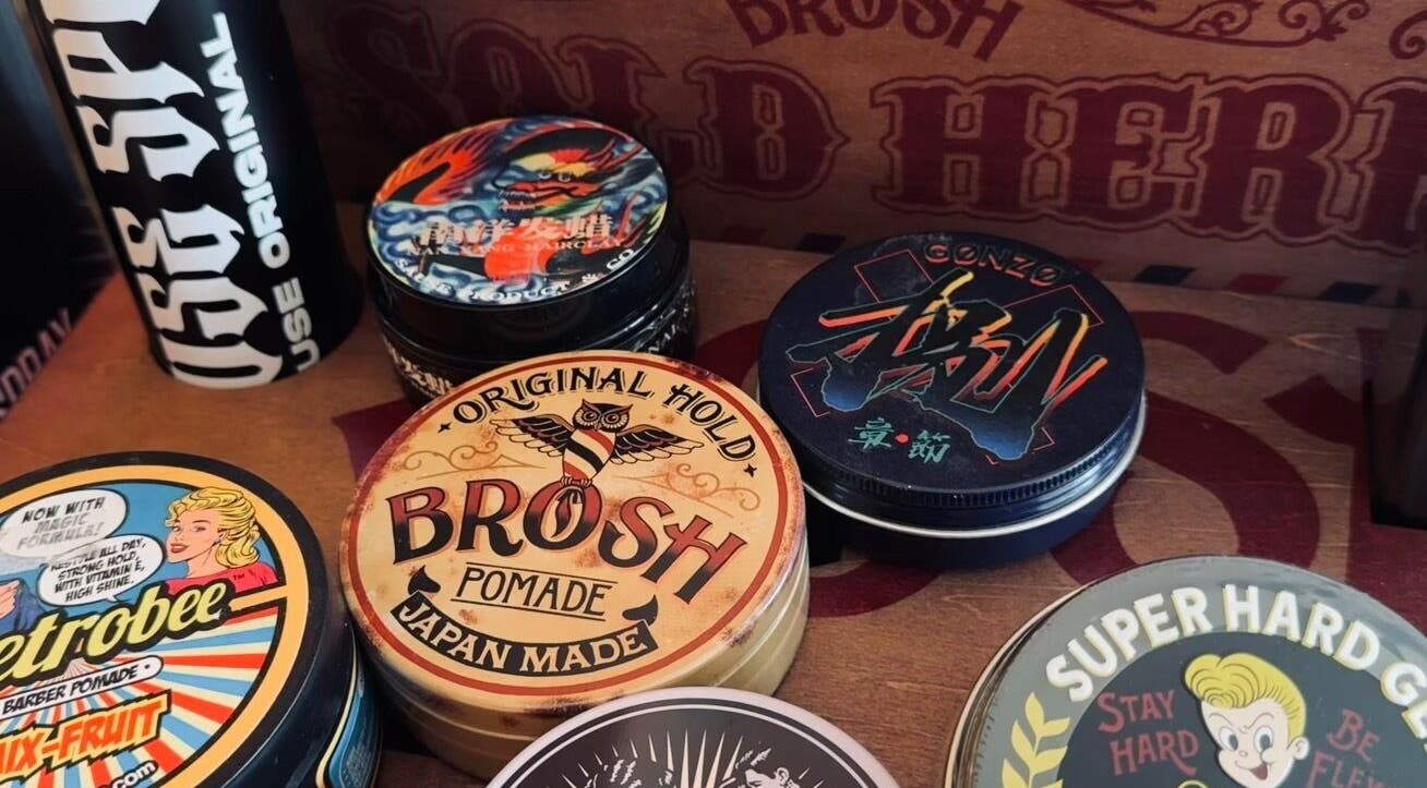 Diverse pomade tins at Sause Barber Cut Club - Sungai Ara, Bayan Lepas, Pulau Pinang, MY showcasing hair styling products.