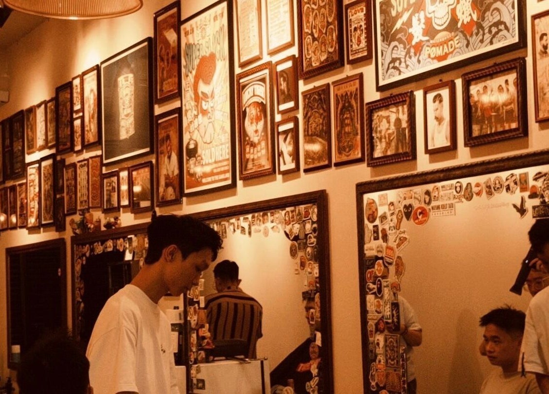 Cozy interior of Sause Barber Cut Club - Sungai Ara in Bayan Lepas, Pulau Pinang, MY, adorned with eclectic wall art.