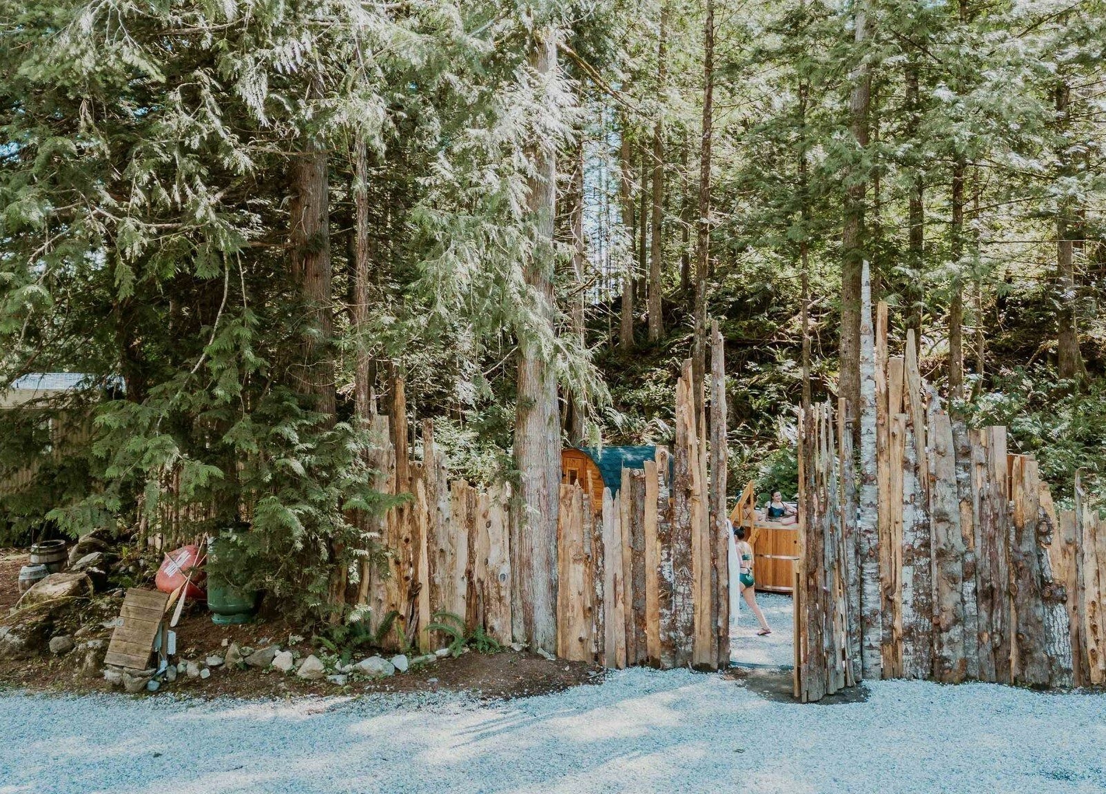 Entrance to The Moonshine Spa surrounded by lush forest in Madeira Park, British Columbia, CA.