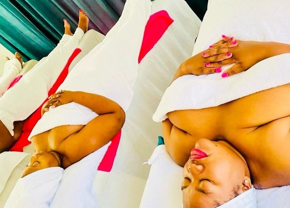 Women relaxing with spa treatments at La Vita E Bella Spa, Johannesburg, Gauteng, ZA, wrapped in white towels.